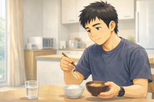 酒の翌日 むくみ 解消のために味噌汁とおかゆを食べる40代男性|消化に良い食事のイメージ